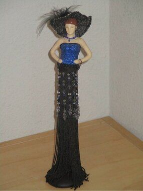 Putting on the Ritz Shiny Dark Blue Poly Resin Hand and Face Tassel Used Good